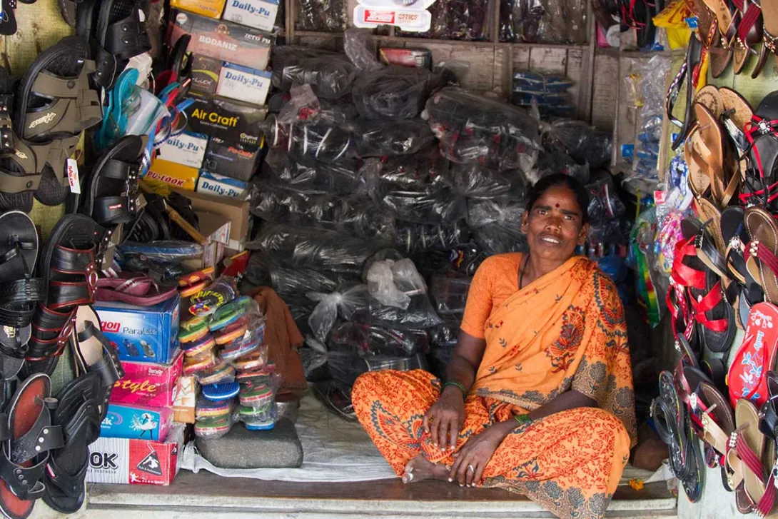 Woman with her footwear roadside stall